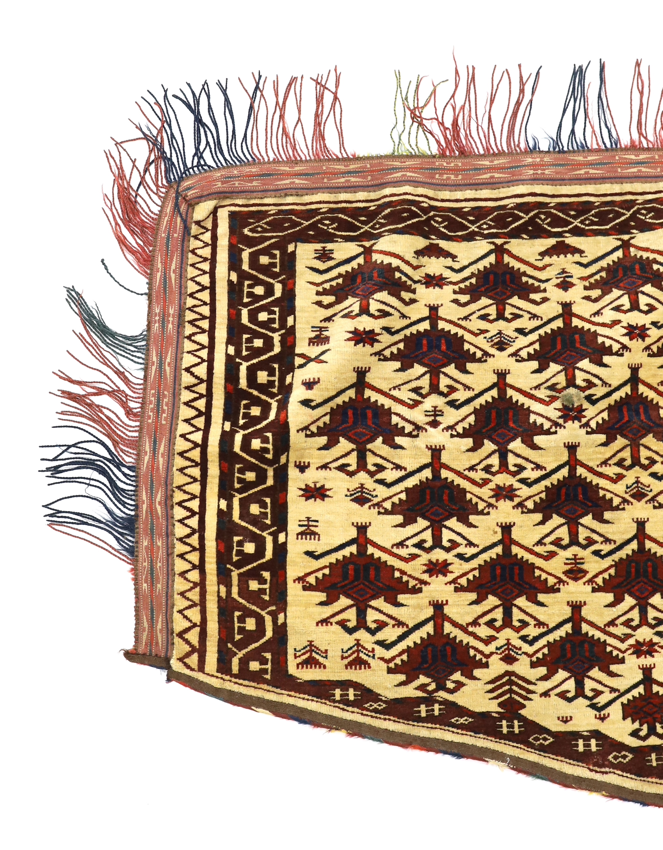 An antique Afghan arched panel woven with rows of stepped decoration on an ivory ground, width 150cm, depth 83cm